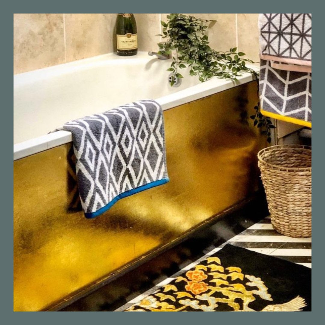 Image of gold golding on bathtub featuring Decorator accents.