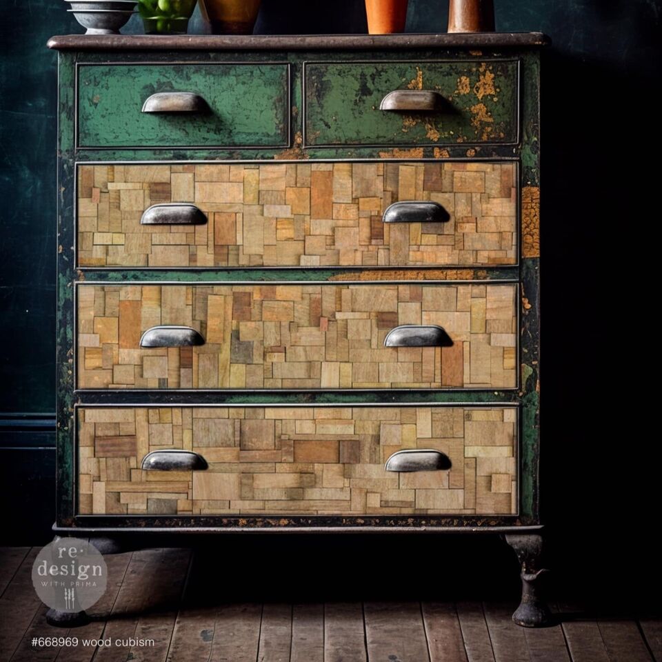 A vintage wooden dresser with a dark green upper section and lower drawers featuring a patchwork of beige and brown wood panels, metallic handles, and curvy legs