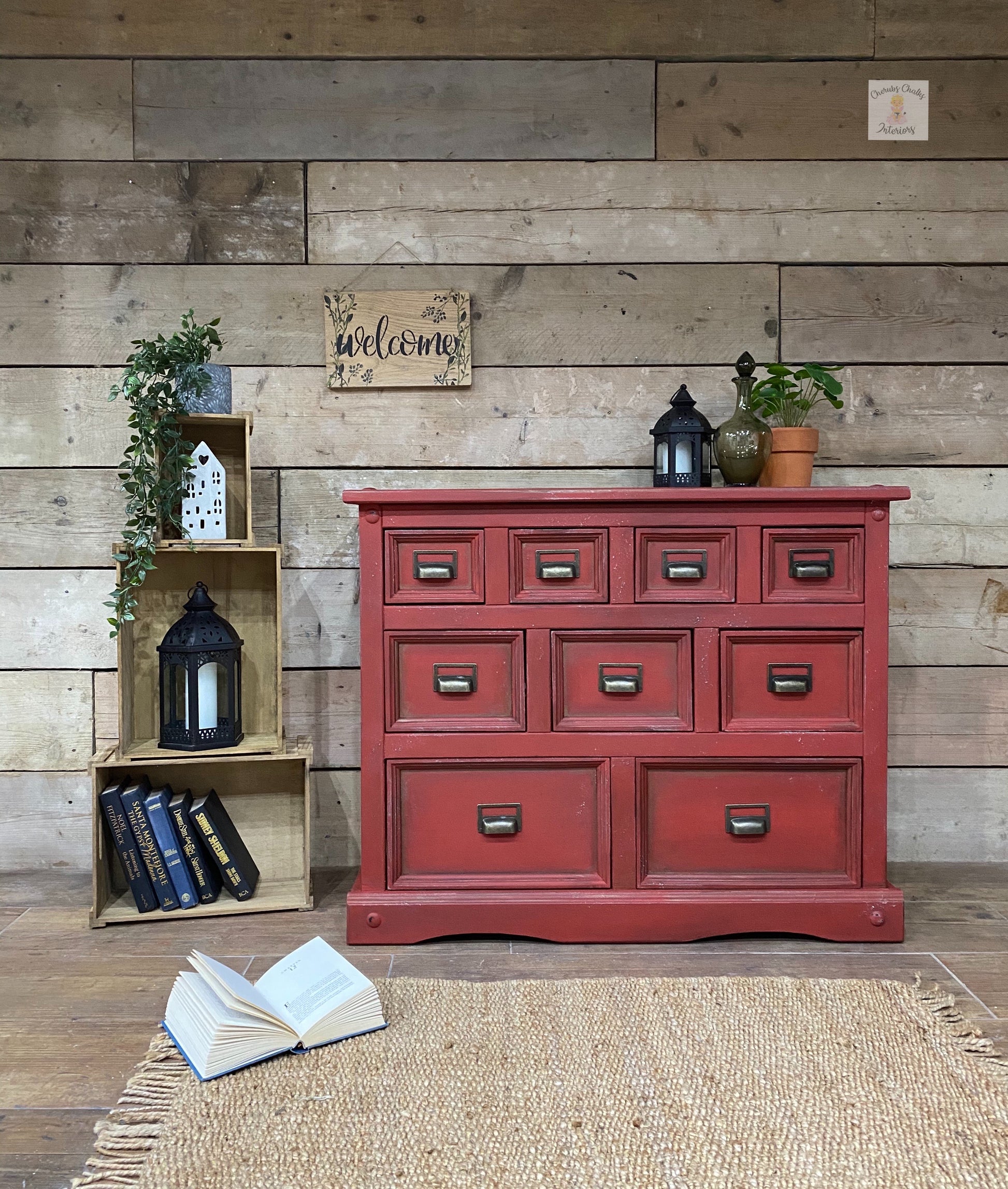 chest of Drawers by brown wood wall covered in rich red Barn Red Dixie Belle Chalk Paint