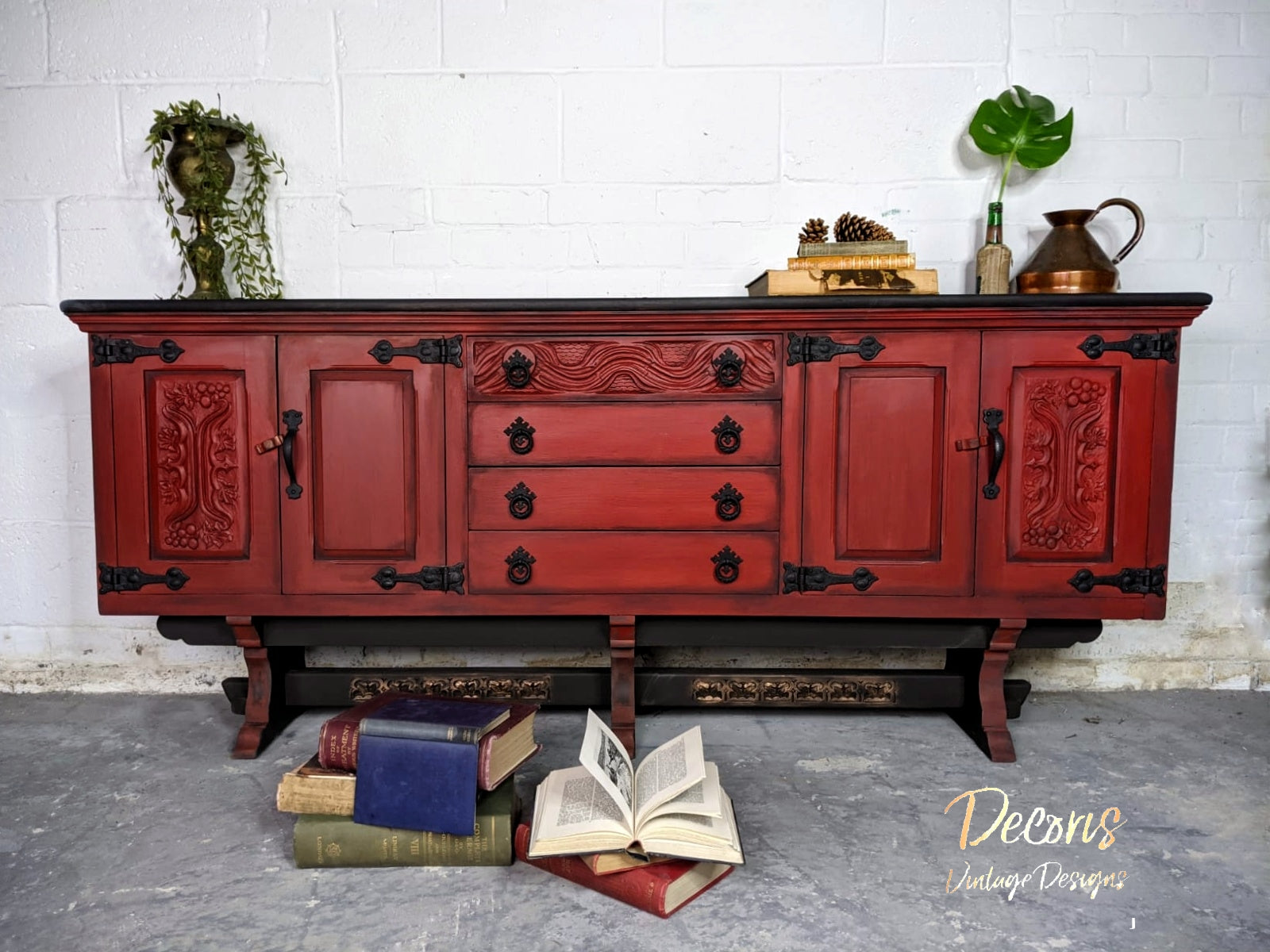 long book cabinet covered in rich red Barn Red Dixie Belle Chalk Paint
