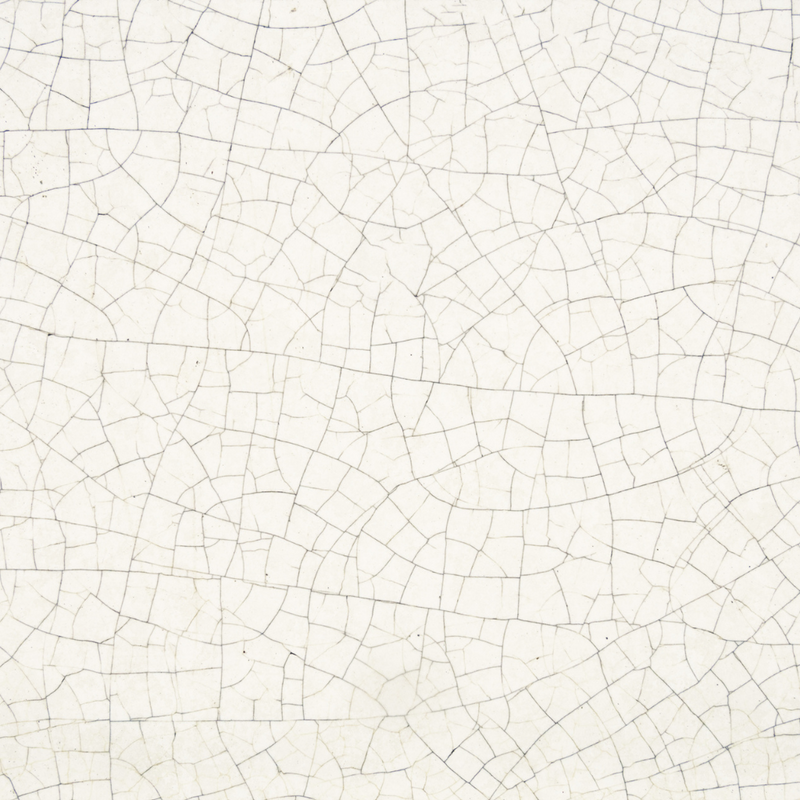 white crackled surface with dark lines