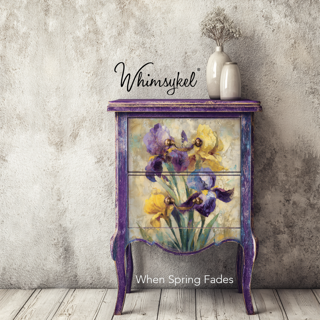 Decorative cabinet with floral design and 'Whimsykel' branding against a textured wall.